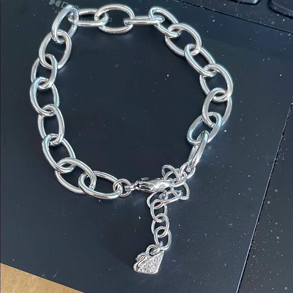 Swavorski silver link charm Bracelet with diamond swan logo charm